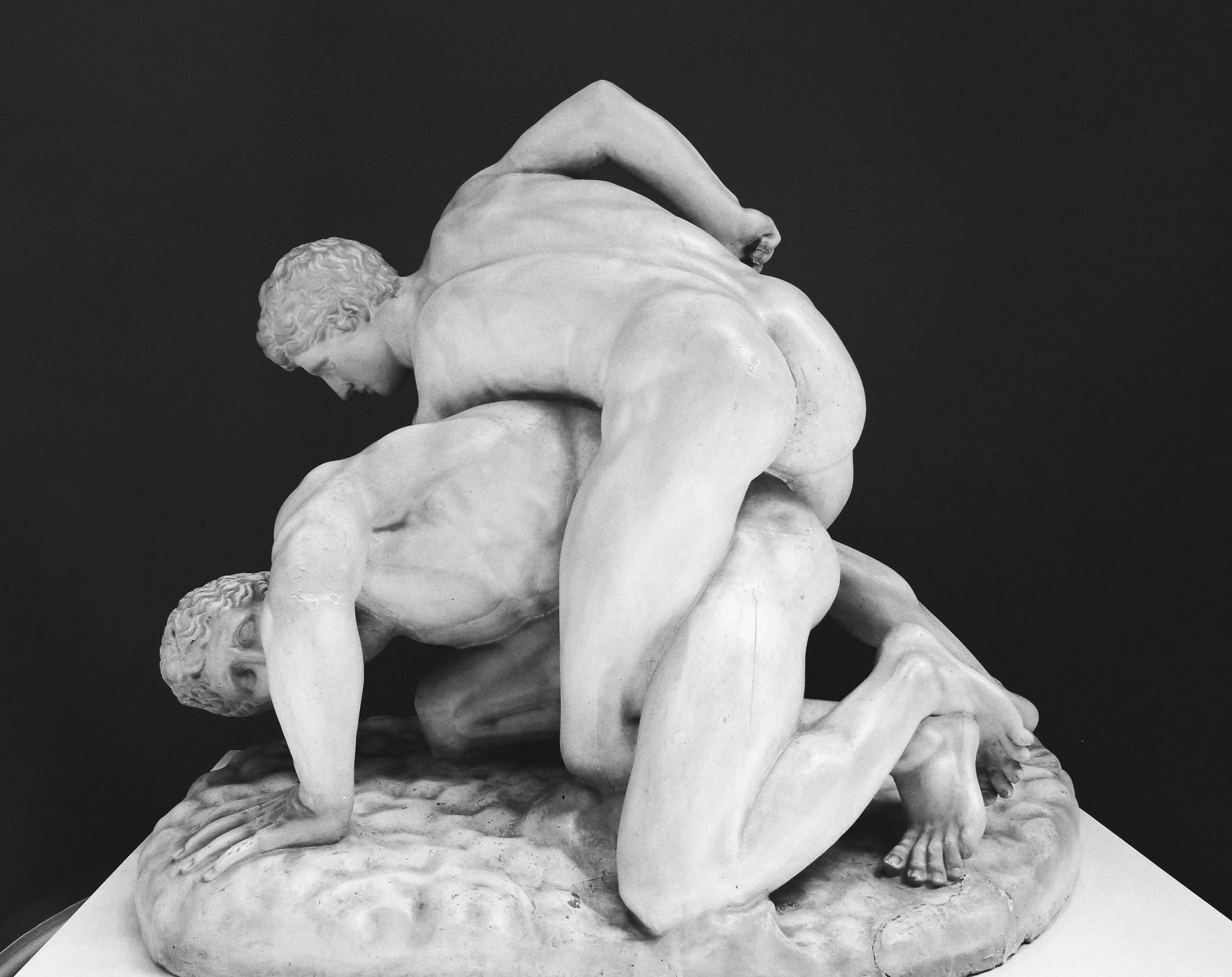 Two men grappling in a forced physical contact exercise